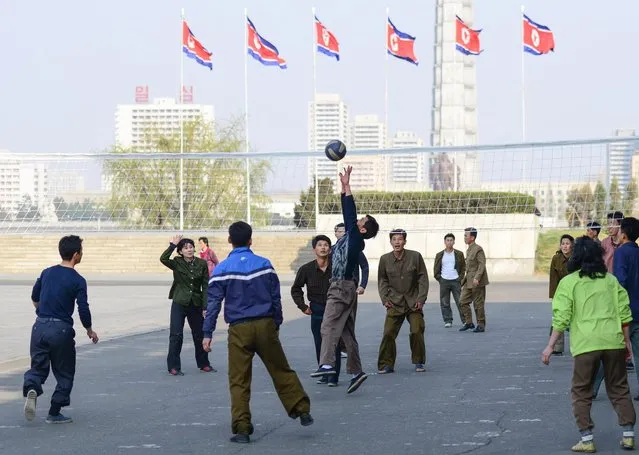North Koreans play volleyball in a public square. Volleyball is reportedly one of the most popular sports in the kingdom. (Photo by Gavin John/Mediadrumworld.com)