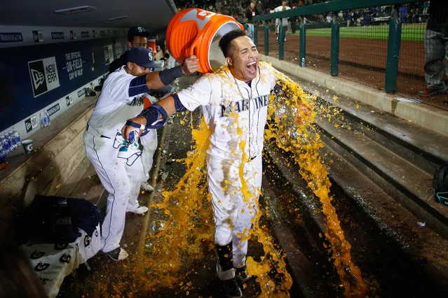 Leonys Martin #12 of the Seattle Mariners is doused by teammates after hitting a two-run walk-off homer to defeat the Oakland Athletics 6-5 at Safeco Field on May 24, 2016 in Seattle, Washington. (Photo by Otto Greule Jr/Getty Images)