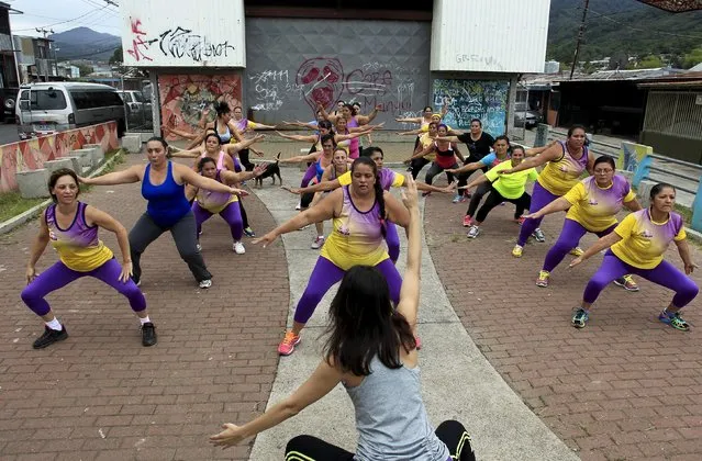 Andrea Abarca, (C) leads an aerobics class in Los Guidos de Desamparados July 23, 2015. (Photo by Juan Carlos Ulate/Reuters)