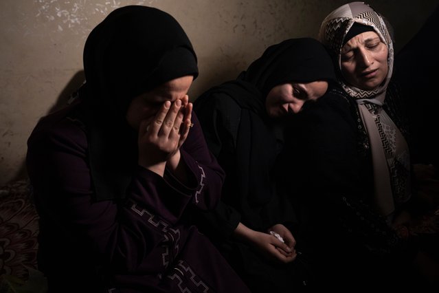 Relatives react during the funeral of Khalil Bahtini, the Islamic Jihad militant group's commander for the northern Gaza Strip, his wife and son, who were killed in an Israeli airstrike at their family home in Gaza City, Tuesday, May 9, 2023. Bahtini was among three senior Islamic Jihad commanders killed in targeted airstrikes early Tuesday. Palestinian health officials said at least 10 others were killed, including wives of two of the militants, several of their children and others nearby. (Photo by Fatima Shbair/AP Photo)