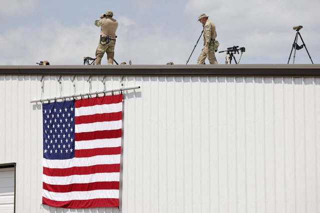 Security forces members keep watch on the day of a campaign rally held by former U.S. President Donald Trump at Asheboro Regional Airport in Asheboro, North Carolina on August 21, 2024. (Photo by Jonathan Drake/Reuters)