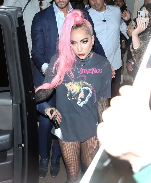 Lady Gaga puts her cutting edge style on display as she leaves her Haus Labs beauty cosmetics pop-up at The Grove in Beverly Hills on December 5, 2019. Gaga, who launched her cosmetics line in September, stuns in a vintage Stevie Nicks graphic shirt, fishnet stockings and black boots while sporting bright pink hair. (Photo by Perez/X17/SIPA Press)