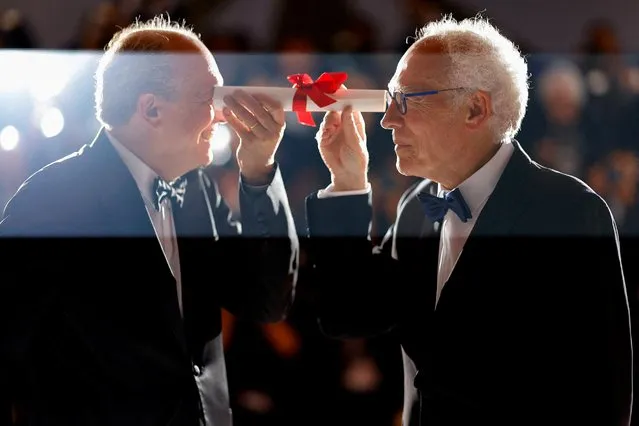 Belgian director Jean-Pierre Dardenne (R) and Belgian director Luc Dardenne pose during a photocall after they won the Prix du 75e Festival for their film “Tori And Lokita” during the Closing Ceremony of the 75th edition of the Cannes Film Festival in Cannes, southern France, on May 28, 2022. (Photo by Stephane Mahe/Reuters)