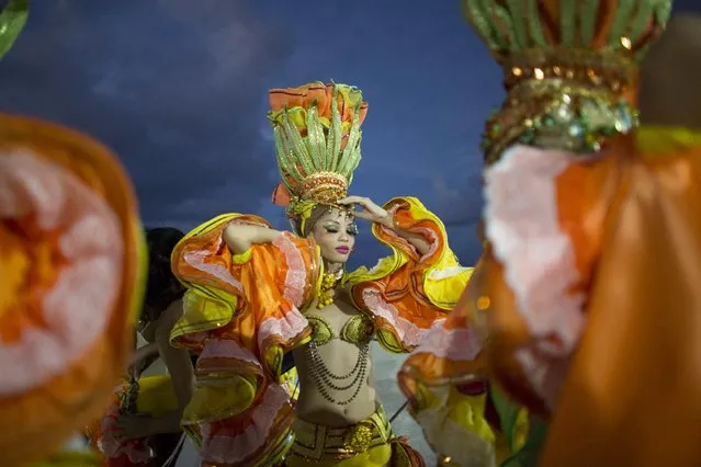 Revelers get ready to perform at a carnival parade in Havana, Cuba August 7, 2015. (Photo by Alexandre Meneghini/Reuters)