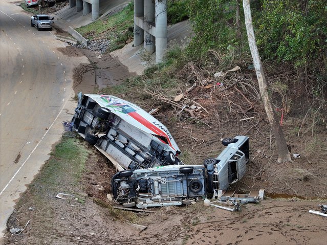 A drone view shows damaged vehicles, following the passing of Hurricane Helene, in Asheville, North Carolina, September 29, 2024. (Photo by Marco Bello/Reuters)