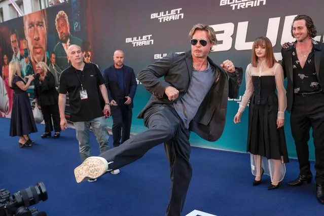 American actor Brad Pitt jokes with camera operators as he arrives for the premiere of the film “Bullet Train” in Paris, Monday, July 18, 2022. (Photo by Lewis Joly/AP Photo)