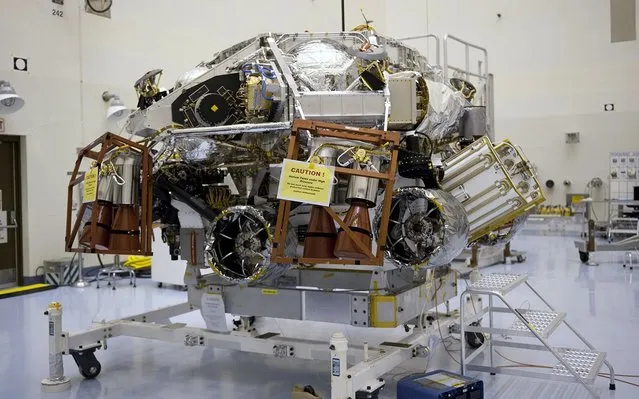 At the Payload Hazardous Servicing Facility at NASA's Kennedy Space Center in Florida, integration is complete between the rocket-powered descent stage and Curiosity (tucked beneath), is complete. (Photo by Kim Shiflett/NASA)