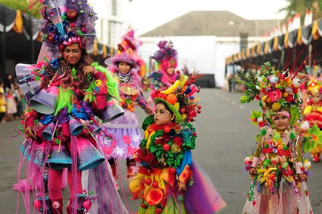 Models wear chemistry inspired costumes in the kids carnival during The 13th Jember Fashion Carnival 2014 on August 21, 2014 in Jember, Indonesia. (Photo by Robertus Pudyanto/Getty Images)