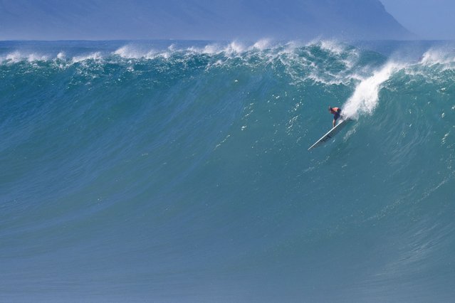 Hawaiian surfer Nathan Florence catches a wave during the 2024 Rip Curl Eddie Aikau Big Wave invitational on the north shore of Oahu, Hawaii, on December 22, 2024. (Photo by Brian Bielmann/AFP Photo)