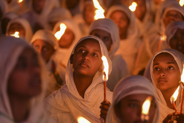 Ethiopian pilgrims pray during a Mass service for Ethiopian Christmas at the Bole Medhane Alem cathedral in Addis Ababa, Ethiopia, Monday, January 6, 2025. (Photo by AP Photo)