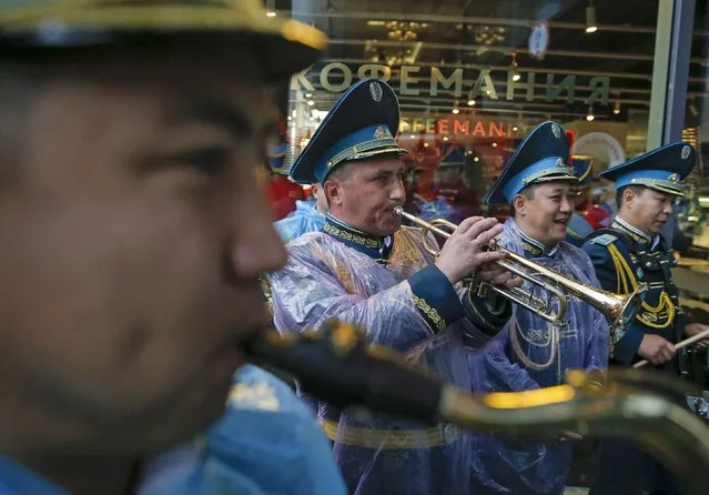 Members of the Band and Squadron of the Honour Guard of the Republican Guard of Kazakhstan perform during the City Day celebration in central Moscow, September 5, 2015. Military bands from different countries will participate in the annual Military Music Festival “Spasskaya Tower” starting on Saturday. (Photo by Maxim Shemetov/Reuters)