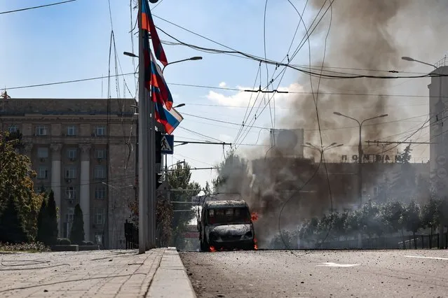 A vehicle on fire after shelling in Donetsk, area controlled by Russian-backed separatist forces, eastern Ukraine, Saturday, September 17, 2022. (Photo by Alexei Alexandrov/AP Photo)