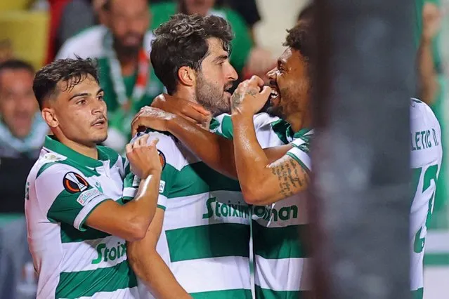 Omonia's Iranian forward Karim Ansarifard (C) is congratulated by his teammates after scoring a goal during the UEFA Europa League group E football match between Cyprus' Omonia Nicosia and England's Manchester United at GSP stadium in the capital Nicosia on October 6, 2022. (Photo by AFP Photo/Stringer)