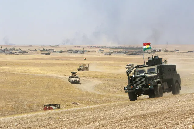 Military vehicles of the Kurdish Peshmerga forces are seen on the southeast of Mosul , Iraq, August 14, 2016. (Photo by Azad Lashkari/Reuters)