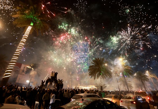 Fireworks explode during New Year celebrations in Baghdad, Iraq, on January 1, 2025. (Photo by Ahmed Saad/Reuters)