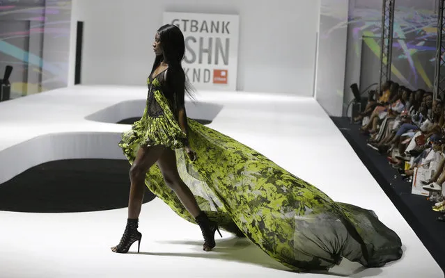 A model displays creations by Julien MacDonald during the Fashion Week in Lagos, Nigeria, Sunday, November 12, 2017. (Photo by Sunday Alamba/AP Photo)