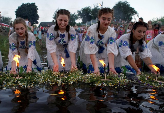 Women take part in the Ivan Kupala festival in the town of Turov, Belarus, July 6, 2020. (Photo by Vasily Fedosenko/Reuters)