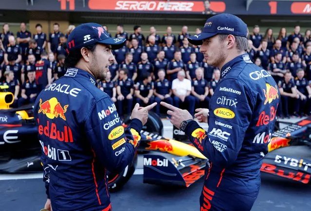 Red Bull's Mexican driver Sergio Perez and Red Bull's Dutch driver Max Verstappen chat before a team photo shoot ahead of the Abu Dhabi Formula One Grand Prix at the Yas Marina Circuit in the Emirati city of Abu Dhabi on November 17, 2022. (Photo by Leonhard Foeger/Reuters)