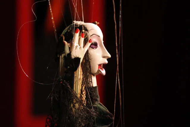 Puppeteers control marionettes during a performance at the Bob Baker Marionette Theater in Los Angeles, California October 17, 2014. (Photo by Lucy Nicholson/Reuters)