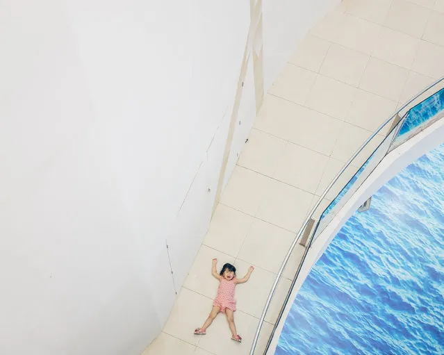 “Temper”. A young girl throws a temper tantrum in a Bangkok shopping mall. Photo location: Bangkok, Thailand, Southeast Asia. (Photo and caption by Adam Birkan/National Geographic Photo Contest)