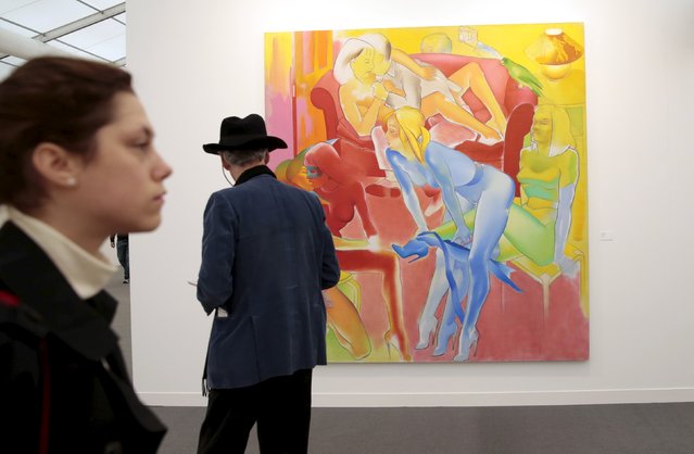 A visitor looks at "The Visitor" by Allen Jones at the Frieze Art Fair in London, Britain October 14, 2015. (Photo by Suzanne Plunkett/Reuters)