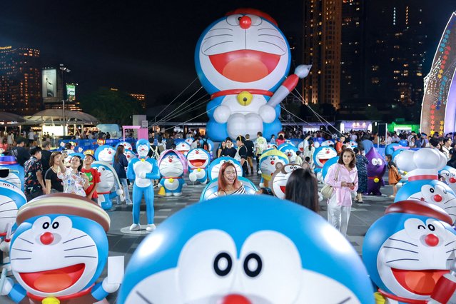 Visitors are seen at the “100% DORAEMON & FRIENDS” tour exhibition in Bangkok, Thailand, on May 2, 2025. (Photo by Athit Perawongmetha/Reuters)