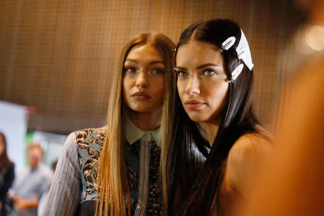 Gigi Hadid (L) and Adriana Lima (R) seen backstage ahead of the Versace show during Milan Fashion Week Spring/Summer 2017 on September 23, 2016 in Milan, Italy. (Photo by Tristan Fewings/Getty Images)