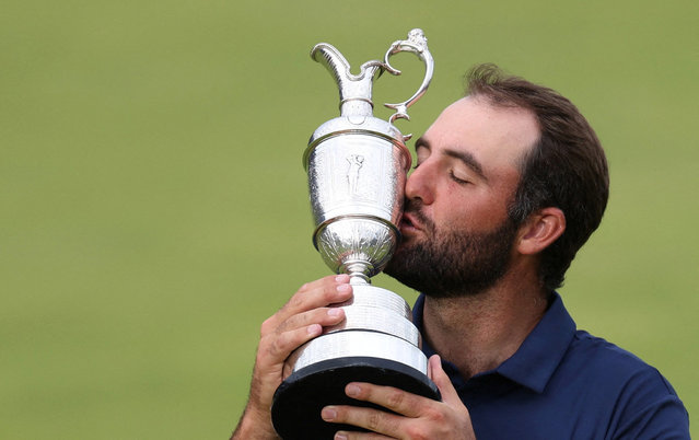Scottie Scheffler of the United States celebrates victory on 18th green with the Claret Jug on Day Four of The 153rd Open Championship at Royal Portrush Golf Club on July 20, 2025 in Portrush, Northern Ireland. (Photo by Russell Cheyne/Reuters)