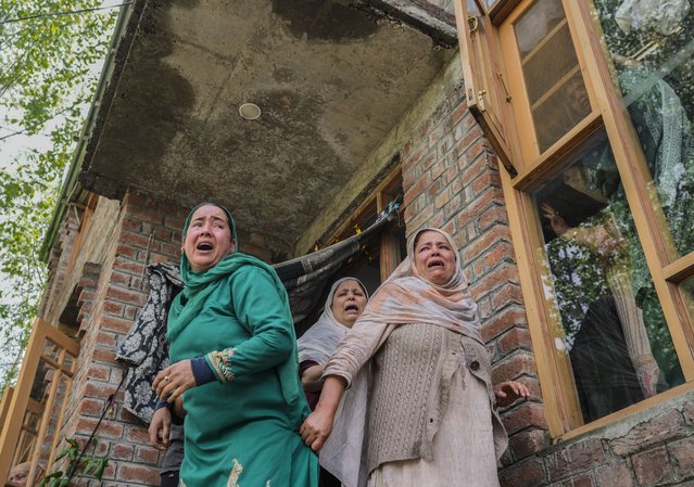 Women weep during a joint funeral of victims of a boat capsize on the outskirts of Srinagar, Indian controlled Kashmir, Tuesday, April. 16, 2024. The boat capsized in Jhelum river, most of the passengers were children, and rescuers were searching for many others who were still missing. (Photo by Mukhtar Khan/AP Photo)