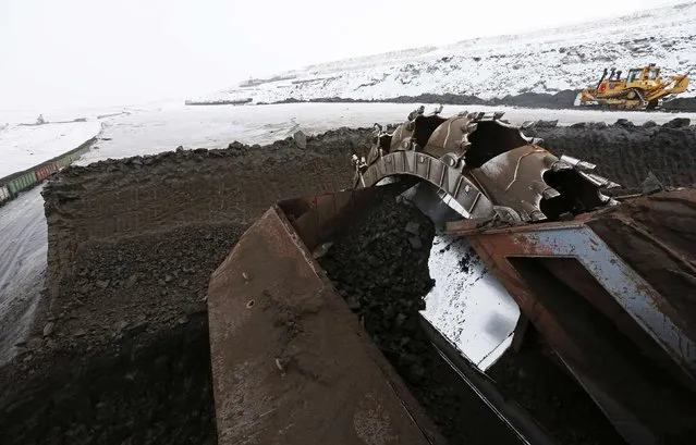 A rotary dredge works on the coal face of the Borodinsky opencast colliery, near the Siberian town of Borodino, east of Krasnoyarsk, December 9, 2014. (Photo by Ilya Naymushin/Reuters)