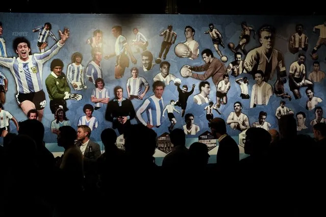 Journalists view the exhibit titled “Campeones del Mundo”, or World Champions at Exposition Center in Buenos Aires, Argentina, Wednesday, April 5, 2023. World Champions is the first official exhibition by the Argentine Soccer Association (AFA) that displays the history of the three world cups won by the national team. (Photo by Natacha Pisarenko/AP Photo)