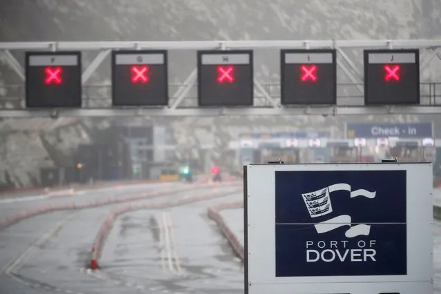 General view of a closed road and the logo of the Port of Dover at the port as EU countries impose a travel ban from the UK, in Dover, Britain, December 21, 2020. (Photo by Matthew Childs/Reuters)