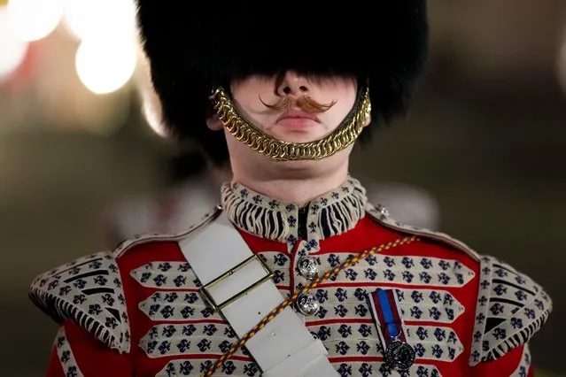 A member of the military marches on The Mall, in central London, early Wednesday, May 3, 2023, during a rehearsal for the Coronation of King Charles III which will take place at Westminster Abbey on May 6. (Photo by Andreea Alexandru/AP Photo)
