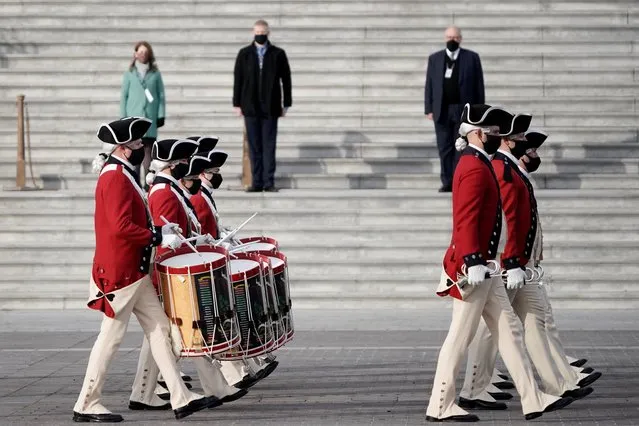 U.S. military units march in front of the U.S. Capitol as they rehearse for U.S. President-elect Joe Biden's inauguration ceremony, in Washington, U.S., January 18, 2021. (Photo by J. Scott Applewhite/Pool via Reuters)