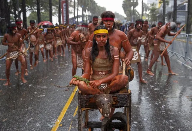 People take part in the 2022 National Carnival Parade, on the Malecon of Santo Domingo, Dominican Republic, 06 March 2022. The first post-pandemic national parade of the Dominican carnival had to appeal this Sunday to its color, enthusiasm and creativity to overcome the inclement rains that delayed and hindered the most popular and unbridled cultural display in the country. (Photo by Orlando Barria/EPA/EFE)