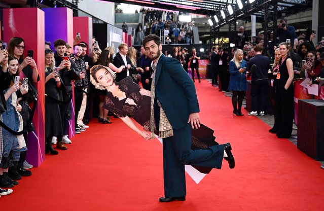 English-American actor Andrew Garfield poses with a cardboard cutout of English actress Florence Pugh at the “We Live In Time” Headline Gala during the 68th BFI London Film Festival at The Royal Festival Hall on October 17, 2024 in London, England. (Photo by Gareth Cattermole/Getty Images for BFI)
