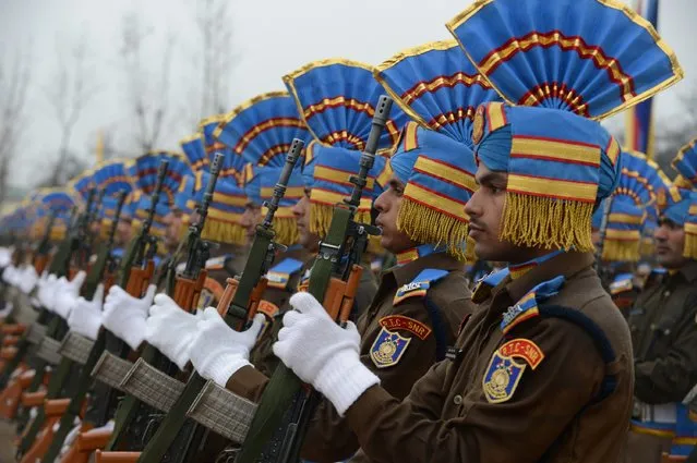 Members of the Indian Central Reserve Police Force (CRPF) take part in a passing out parade at the CRPF headquarters in Srinagar on December 11, 2015. Some 648 new recruits were inducted into the force which is fighting the insurgency in Kashmir, which has been divided between India and Pakistan since they gained independence from Britain in 1947. (Photo by Tauseef Mustafa/AFP Photo)