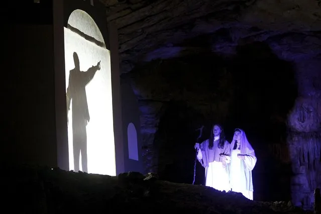 Actors perform the living Nativity biblical scenes in Postojna cave in Postojna, Slovenia, December 22, 2015. (Photo by Srdjan Zivulovic/Reuters)
