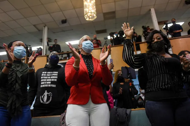 Floyd family members react on Sunday evening during a prayer vigil hosted by Rev. Al Sharpton and Attorney Ben Crump on behalf of the Floyd family at the Greater Friendship Missionary church, the day before opening statements in the trial of former police Derek Chauvin, who is facing murder charges in the death of George Floyd, in Minneapolis, Minnesota, March 28, 2021. (Photo by Nicholas Pfosi/Reuters)