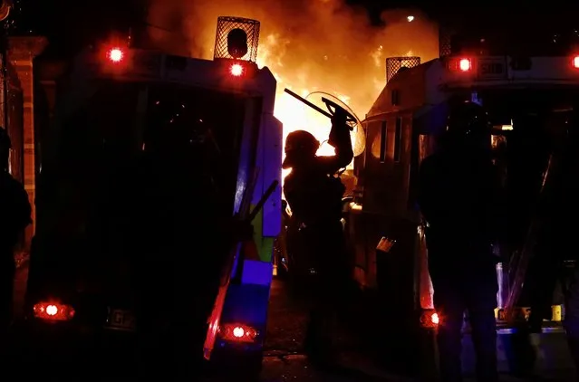 Police take security measures and deployed water cannons as rioters hurled petrol bombs, fireworks and stones at police amid unrest since Wednesday, in Belfast, Northern Ireland on April 09, 2021. â¨The unrest started when some Sinn Fein members attended a crowded funeral on top of tensions caused by Brexit border arrangements, which brought checks on goods shipped between Northern Ireland and the rest of the UK. â¨Both loyalist and nationalist areas were involved in riots in west Belfast. (Photo by Hasan Esen/Anadolu Agency via Getty Images)