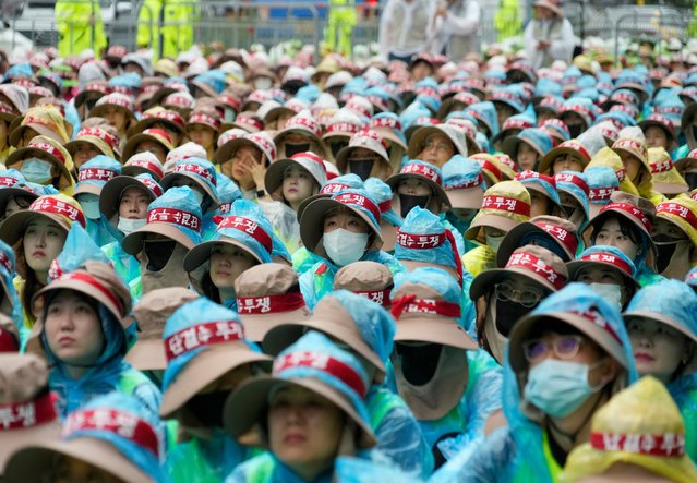 Members of the Korean Health and Medical Workers' Union participate in a rally against the government's labor policy in Seoul, South Korea, Thursday, July 13, 2023. Thousand medical workers launched a two-day strike on Thursday to demand better working conditions and increased support for public medical institutions, Yonhap news agency reported. (Photo by Ahn Young-joon/AP Photo)