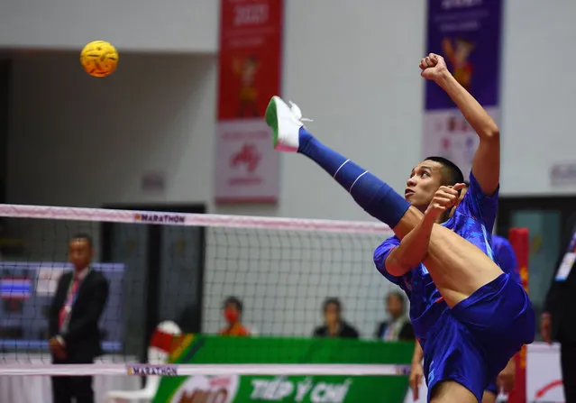 Thailand's Pornthep Tinbangbon kicks a shot in the sepaktakraw match against Vietnam during the 31st Southeast Asian Games (SEA Games) in Hanoi on May 14, 2022. (Photo by Nhac Nguyen/AFP Photo)