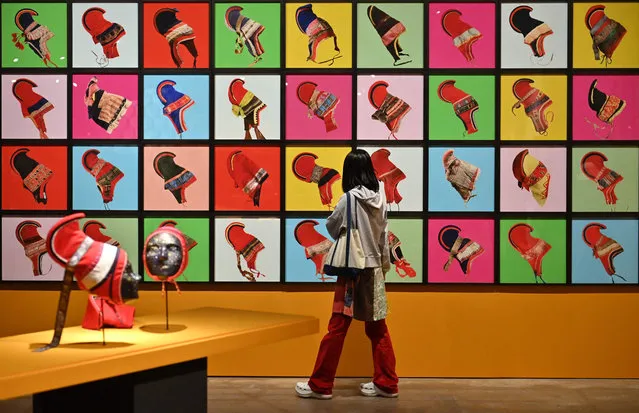 This picture taken on March 31, 2021 shows a visitor looking at the art installation “Outi Pieski” by Eeva-Kristiina Harlin during a preview of the 13th Gwangju Biennale at an exhibition hall in the southwestern city of Gwangju. (Photo by Jung Yeon-je/AFP Photo)