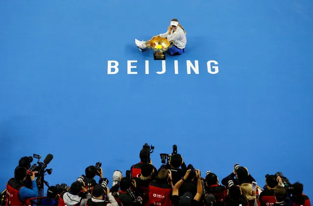 Caroline Wozniacki of Denmark poses with the trophy after winning the women' s final against Anastasija Sevastova of Latvia at the China Open tennis tournament in Beijing on October 7, 2018. (Photo by Thomas Peter/Reuters)