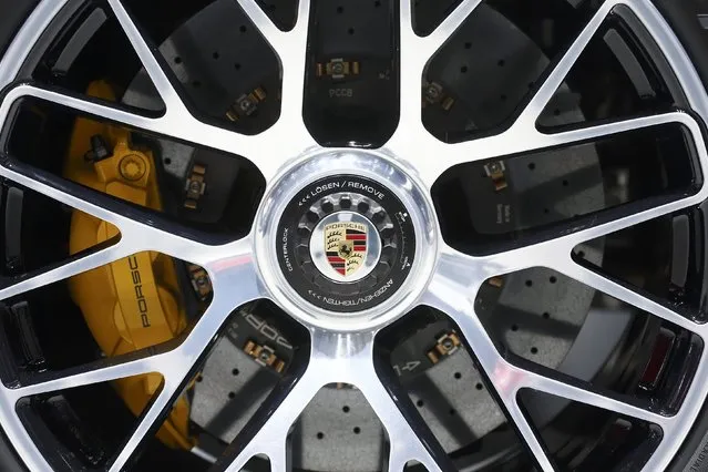 The wheel hub and brake of a Porsche 911 Turbo S sports car are seen during the second press day ahead of the 85th International Motor Show in Geneva March 4, 2015. REUTERS/Arnd Wiegmann   