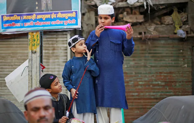 Muslim boys attend a religious procession to mark Eid-e-Milad-ul-Nabi, or birthday celebrations of Prophet Mohammad, in the old quarters of Delhi, November 21, 2018. (Photo by Adnan Abidi/Reuters)