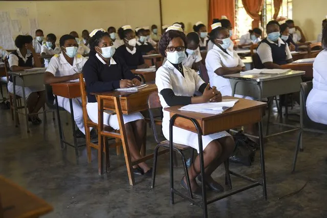 Nursing and midwifery students sit in class at St Joseph College of Nursing and Midwifery in Chiradzulu southern Malawi on Friday May 28, 2021. (Photo by Thoko Chikondi/AP Photo)