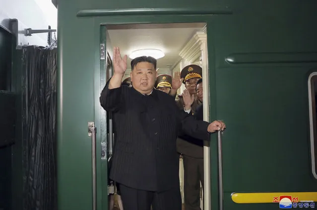 This September 10, 2023 photo provided by the North Korean government shows that North Korea leader Kim Jong Un waves from a train in Pyongyang, North Korea, as he leaves for Russia. Independent journalists were not given access to cover the event depicted in this image distributed by the North Korean government. The content of this image is as provided and cannot be independently verified. Korean language watermark on image as provided by source reads: “KCNA” which is the abbreviation for Korean Central News Agency. (Photo by Korean Central News Agency/Korea News Service via AP Photo)