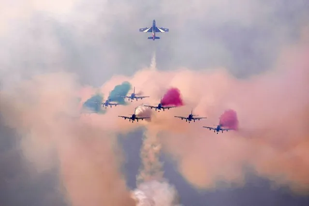 Frecce Tricolori (Tricolor Arrows), the Italian Air Force aerobatic display team, perform during the opening day of the Dubai Air Show, United Arab Emirates, Monday, November 13, 2023. (Photo by Kamran Jebreili/AP Photo)