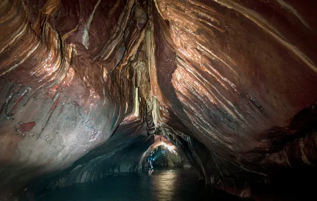Cameron Smith, from Arbroath, explores Moby's Cave, which forms part of a network of caves under the Arbroath Cliffs on the Angus coast, Scotland on Tuesday, July 20, 2021. (Photo by Jane Barlow/PA Images via Getty Images)